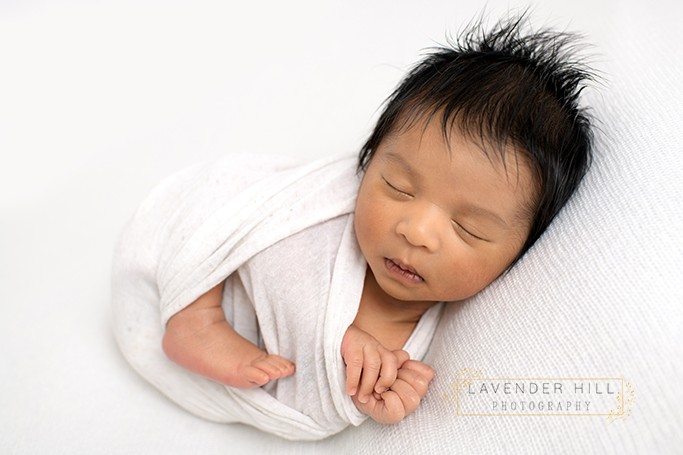 newborn baby photography north east london, baby sleeping in a sling
